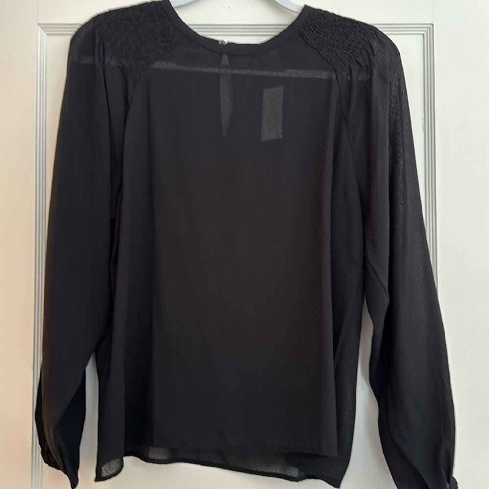 Black semi sheer blouse with smocking at shoulders.  Key hole button closure NWT